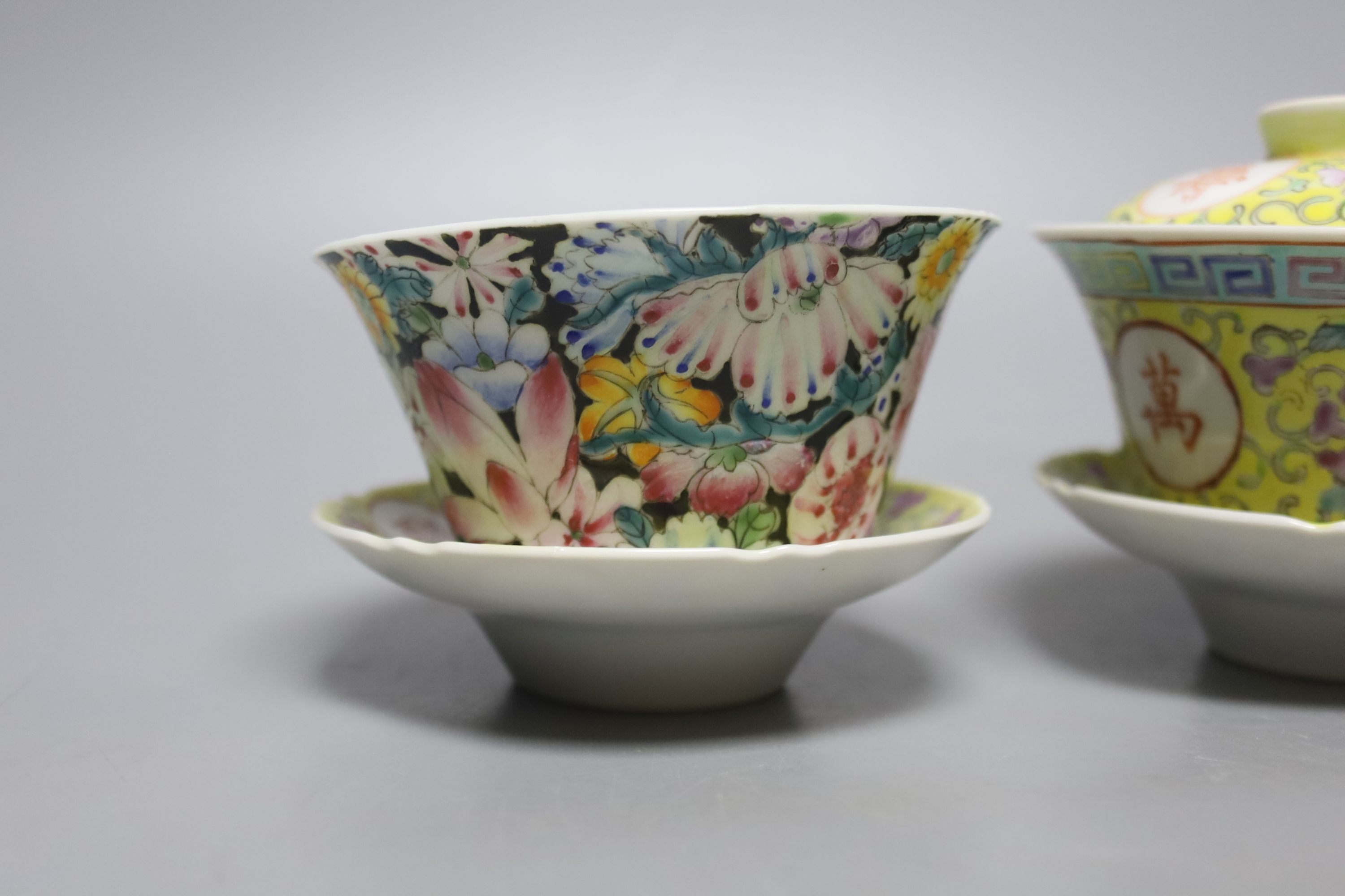 A pair of Chinese enamelled porcelain rice bowls, covers and stands and an odd bowl